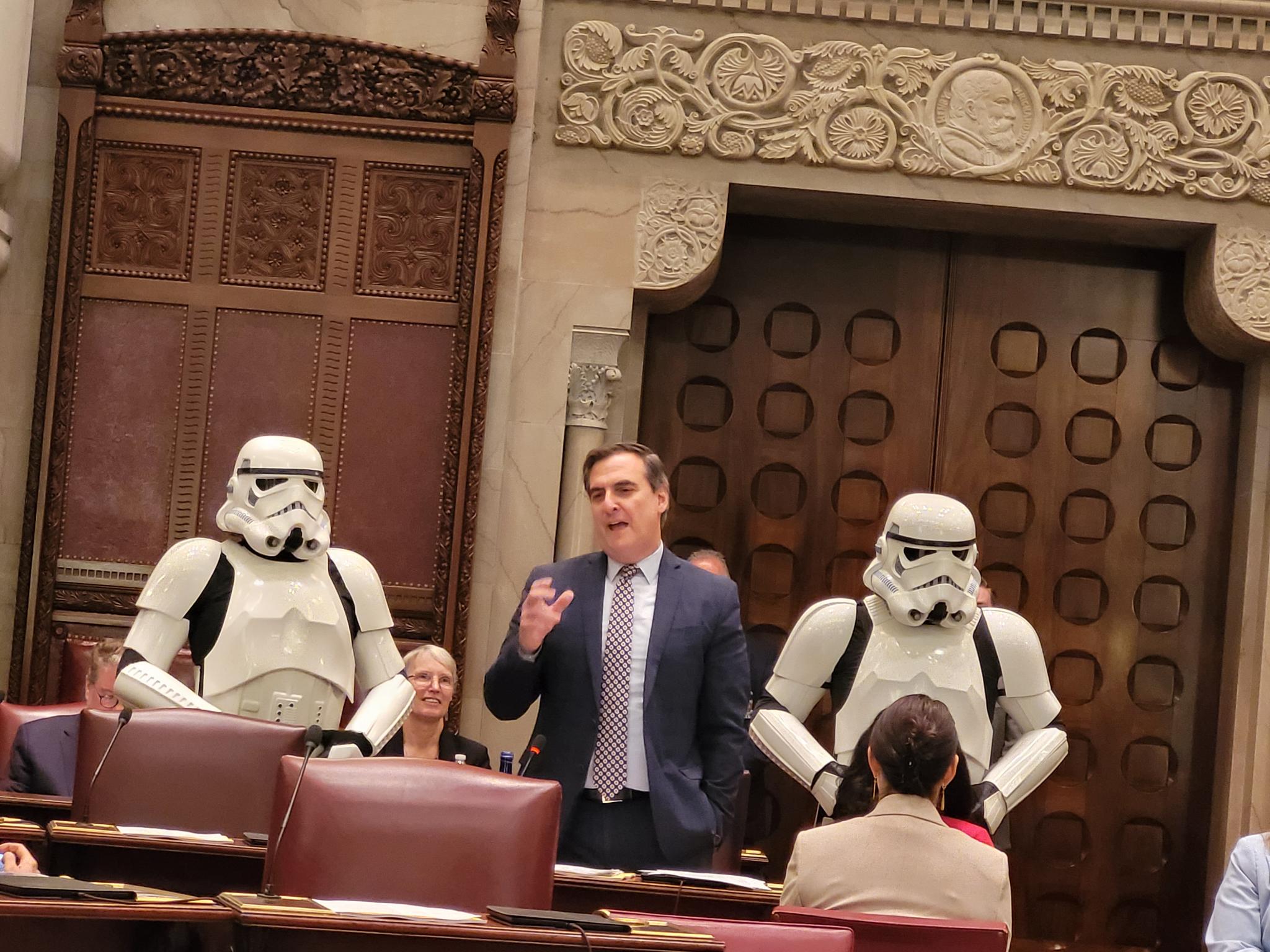 Senate Deputy Majority Leader Michael Gianaris is flanked by stormtroopers.