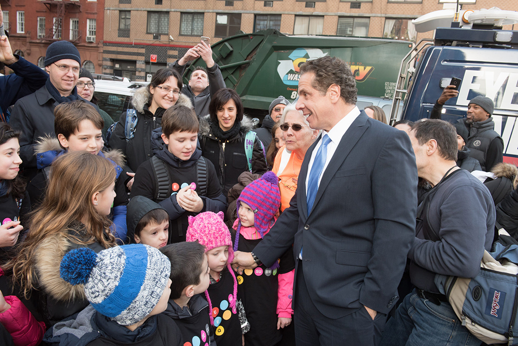 Andrew Cuomo looking at children